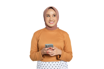 Young Muslim woman in hijab smiling and holding smartphone with both hands while looking up isolated on transparent background