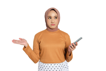 Confused Muslim woman in hijab holding smartphone and raising hand isolated on transparent background