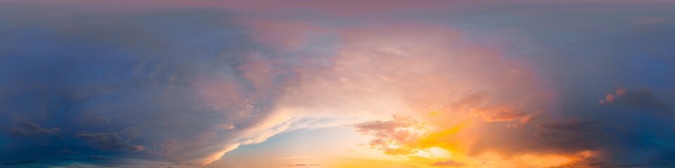 Sunset sky with bright glowing pink Cumulus clouds. Seamless spherical HDR 360 panorama. Full...