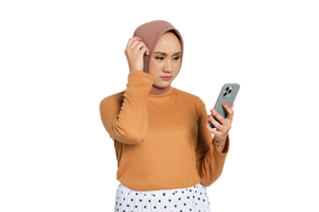 Confused Muslim woman in hijab looking at smartphone with puzzled expression holding head isolated on transparent background