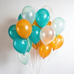 A vibrant bunch of teal and orange balloons isolated on white background