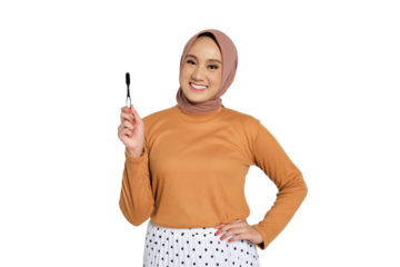 Smiling Muslim woman in hijab holding toothbrush with dental care concept isolated on transparent background