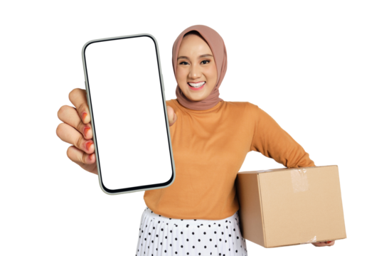 Happy woman wearing hijab holding smartphone with blank screen and cardboard box isolated on transparent background