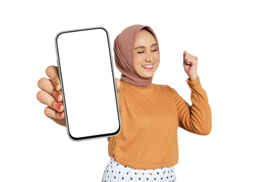 Excited woman wearing hijab holding blank smartphone screen and making fist gesture isolated on transparent background - Powered by Adobe