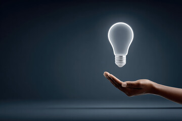 Innovative ideas emerge floating light bulb in hand studio setting conceptual photography dim lighting environment creative visualization