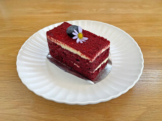Red velvet cake on white ceramic dish