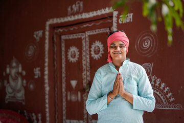 Happy indian farmer smiling and doing namaste