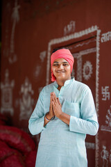 Happy indian farmer smiling and doing namaste