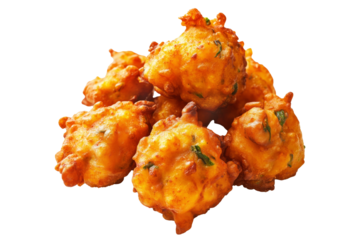 Crispy golden vegetable Indian fritters Pakoras with herbs, isolated on white transparent background, concept of traditional snack