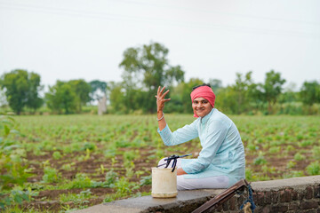 happy farmer at agriculture field