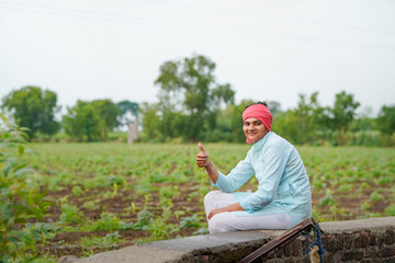 happy farmer at agriculture field