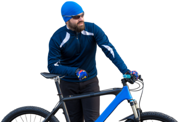 A guy in sportswear riding clothes on a modern mountain carbon bike with an air suspension fork at a vintage brick concrete wall.