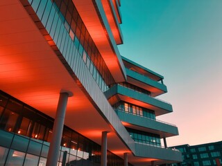 Modern Architectural Building with Glass Facades and Red Lighting