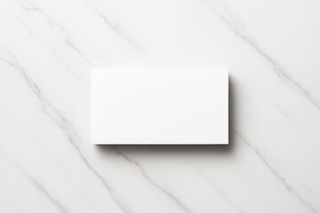Blank white business card mockup placed on clean marble background for branding, design template, poster, or advertising presentation concept.