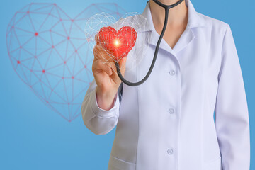 Closeup of a doctor using a stethoscope on a digital heart, highlighting modern medical technology