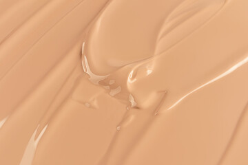 The texture of foundation powder in a natural tone. Liquid cream makeup product. Beautiful cosmetic...