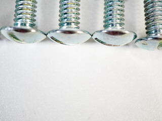 Screws aligned showcasing hardware construction and manufacturing, suitable for industrial and...