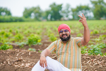 happy farmer at agriculture field