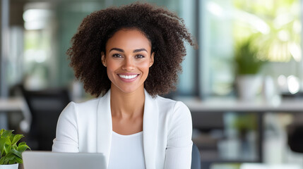 Confident woman smiling in modern office environment, showcasing professionalism and warmth