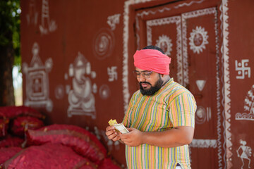 indian farmer counting money