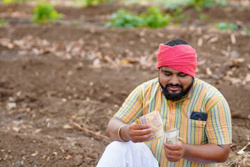 indian farmer counting money