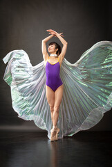 Young woman ballet dancer with silver wings in Connecticut.
