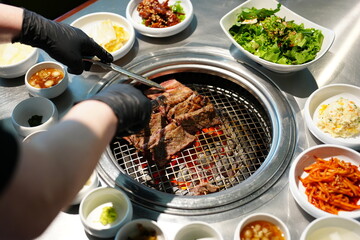 Korean BBQ with Raw Beef Short Ribs Grilled on Charcoal at Local Galbi Restaurant