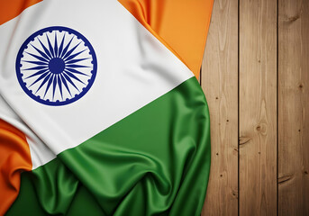 silky indian national flag on wood planks. patriotic background for indian cultural events, celebrations, and holidays.