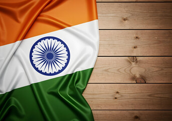 indian flag on a wooden background with copy space. wallpaper for india's independence day or republic day celebration.