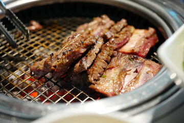 Korean BBQ with Raw Beef Short Ribs Grilled on Charcoal at Local Galbi Restaurant
