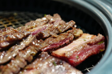 Korean BBQ with Raw Beef Short Ribs Grilled on Charcoal at Local Galbi Restaurant