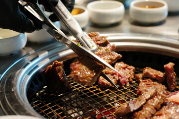 Korean BBQ with Raw Beef Short Ribs Grilled on Charcoal at Local Galbi Restaurant