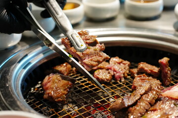 Korean BBQ with Raw Beef Short Ribs Grilled on Charcoal at Local Galbi Restaurant