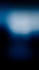 Obraz premium Blurry dark blue gradient with central white glow, calm and mysterious