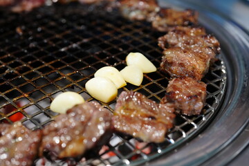 Korean BBQ with Raw Beef Short Ribs Grilled on Charcoal at Local Galbi Restaurant