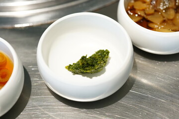 Korean BBQ with Raw Beef Short Ribs Grilled on Charcoal at Local Galbi Restaurant