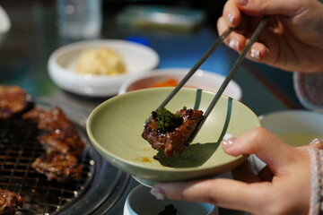 Korean BBQ with Raw Beef Short Ribs Grilled on Charcoal at Local Galbi Restaurant
