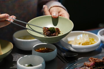 Korean BBQ with Raw Beef Short Ribs Grilled on Charcoal at Local Galbi Restaurant