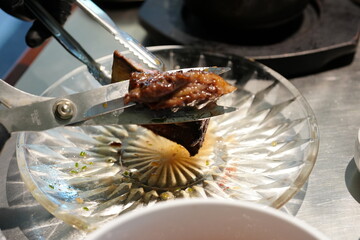 Korean BBQ with Raw Beef Short Ribs Grilled on Charcoal at Local Galbi Restaurant