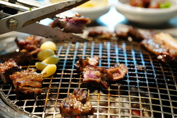Korean BBQ with Raw Beef Short Ribs Grilled on Charcoal at Local Galbi Restaurant