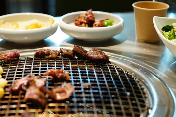 Korean BBQ with Raw Beef Short Ribs Grilled on Charcoal at Local Galbi Restaurant