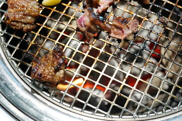 Korean BBQ with Raw Beef Short Ribs Grilled on Charcoal at Local Galbi Restaurant