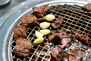Korean BBQ with Raw Beef Short Ribs Grilled on Charcoal at Local Galbi Restaurant