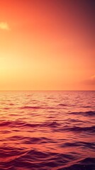 Fototapeta premium Serene ocean view at sunset with warm and soft light reflections