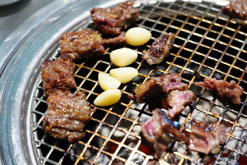 Korean BBQ with Raw Beef Short Ribs Grilled on Charcoal at Local Galbi Restaurant