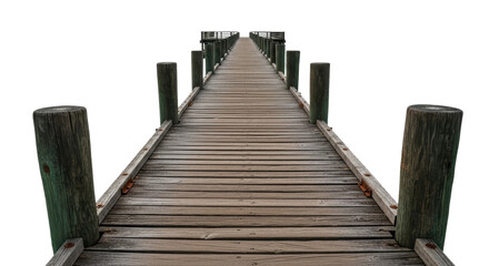 Fototapeta premium A long, weathered wooden pier stretches into the horizon, featuring sturdy posts along its sides. Ideal for concepts of journey, connection, or escape.