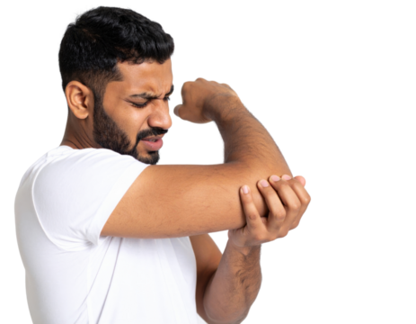 Young man with beard touching and examining painful elbow joint showing arthritis discomfort and arm injury symptoms
