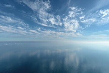 Obraz premium Calm, reflective ocean meets a vast, fluffy sky
