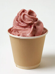 Swirled frozen strawberry ice cream served in decorative paper cup
