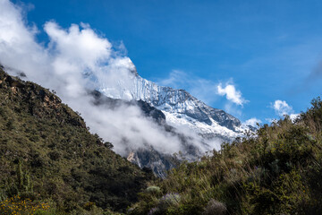 Snow-capped mountains and valley along the Laguna 69 trek in Huaraz, Peru
